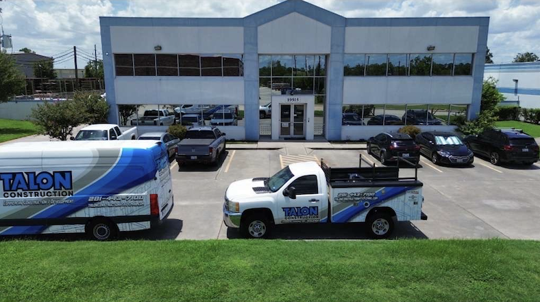 Image of Talon Construction vehicles and building.